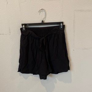 Happening in the present, black tie shorts